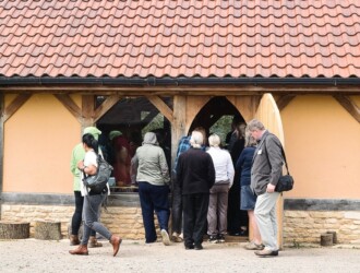 Group of people outside a building at Stanwick Lakes