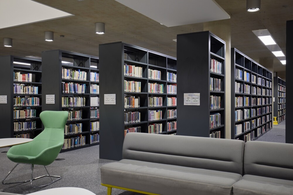 View of library book stacks in the Learning Hub