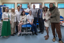 University of Northampton Podiatry students are pictured in uniform at the University’s Podiatry Clinic with Hope Centre service users and staff.