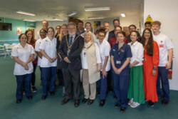 Group photo taken at the reception desk of University of Northampton’s Podiatry Clinic. Included in the picture are Mayor and Mayoress of Northampton Cllr Stephen Hibbert and Liz Cox, UON Vice Chancellor Professor Anne-Marie Kilday, and Podiatry students and staff, including Programme Lead Lisa Chandler.