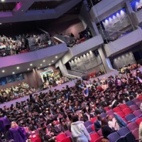 Spring 2025 Graduation guests are pictured taking their seats in the auditorium or Royal & Derngate.