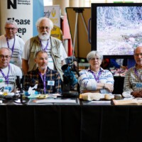 members of the Northamptonshire Natural History Society ready themselves to talk with STEAM Northants 2025 guests.