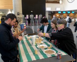 A group of staff and students make bird feeders in the Learning Hub atrium.