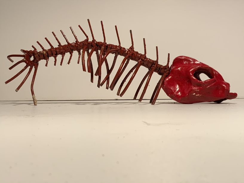 Sculpture of a red fish skeleton