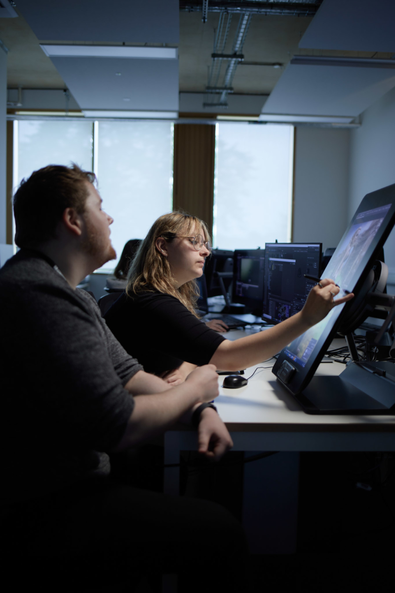 Two students working on an on-screen design